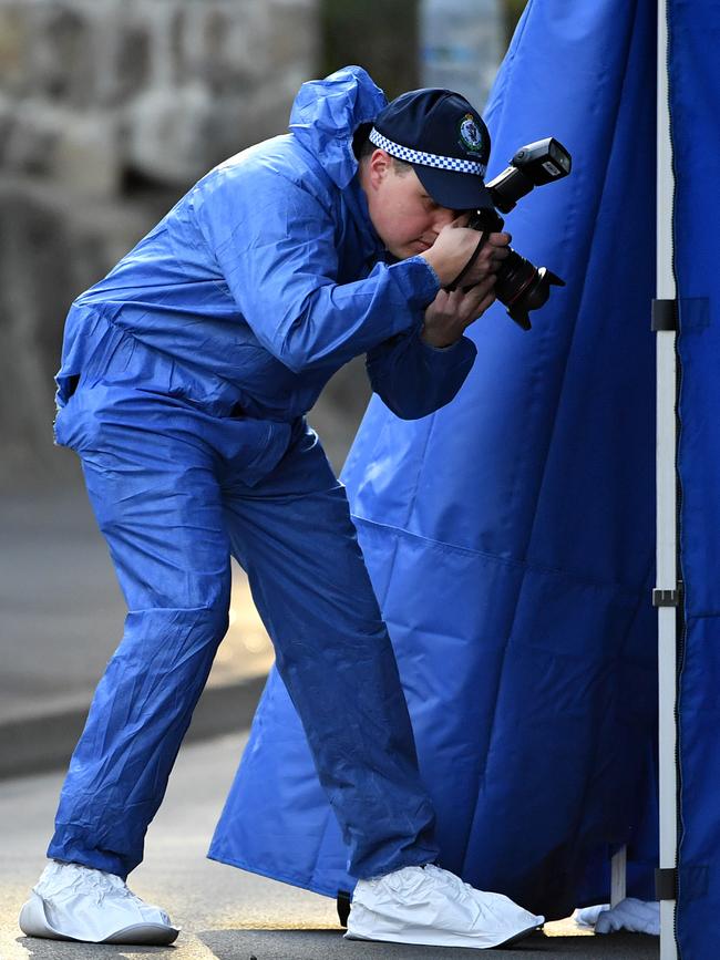 Forensic police officers at the scene. Picture: AAP Image/Joel Carrett