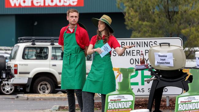 Nick Haines and Nish Humphrey from consumer group SumOfUs protesting about the sale of Roundup up outside Port Melbourne Bunnings. Picture: NCA NewsWire/David Geraghty