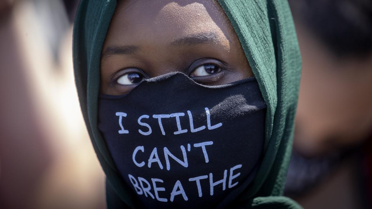 Wearing masks at parades is to be recommended. Picture: Elizabeth Flores/Star Tribune via AP.