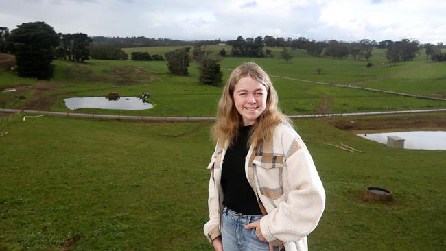 Drouin Secondary College year 12 student Larah Thexton on her grandparents’ dairy farm at Drouin South. Her love of dairy cattle prompted her to enrol in an agriculture class in Year 10. Picture: Yuri Kouzmin