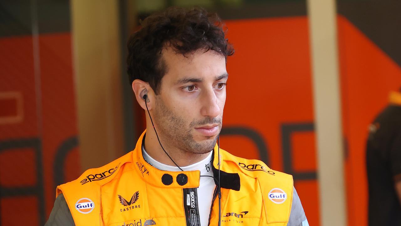 McLaren driver Daniel Ricciardo slides into his seat of his car. Picture: David Caird.