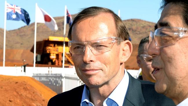 Prime Minister Tony Abbott, left, and Japanese Prime Minister Shinzo Abe tour the Rio Tinto West Angelas iron ore mine in the Pilbara, Western Australia, Wednesday, July 9, 2014. Abe is in Australia on a four day official visit (AP Photo/Alan Porritt, Pool)