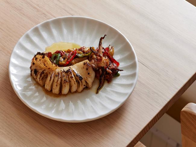 Whole grilled squid, red capsicum at Cottage Kitchen restaurant, North Adelaide . Picture: Supplied