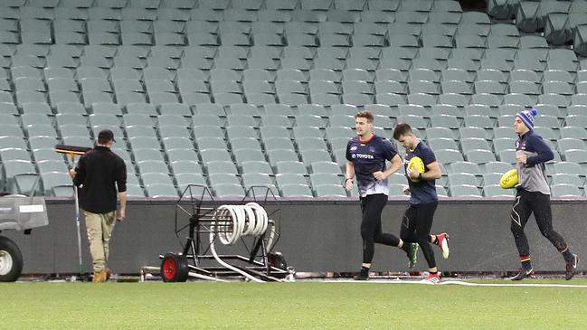 Jenkins, Gibbs and Fogarty ran for half-an-hour, including sprints across the ground in heavy rain after the Crows lost to West Coast. Picture: Sarah Reed.