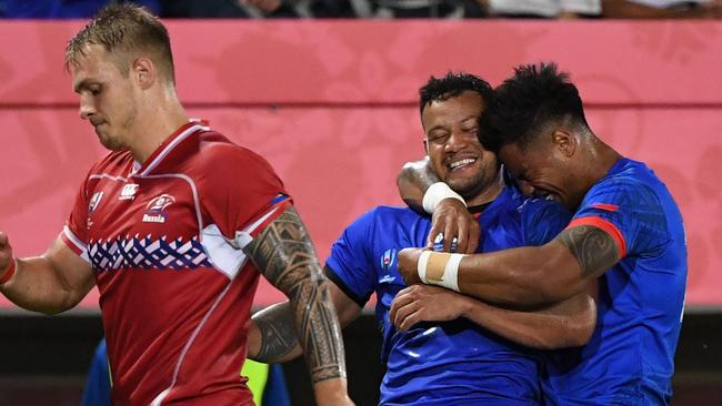 Samoa's centre Alapati Leiua celebrates with fly-half Ulupano Seuteni after scoring a try against Russia. Picture: AFP