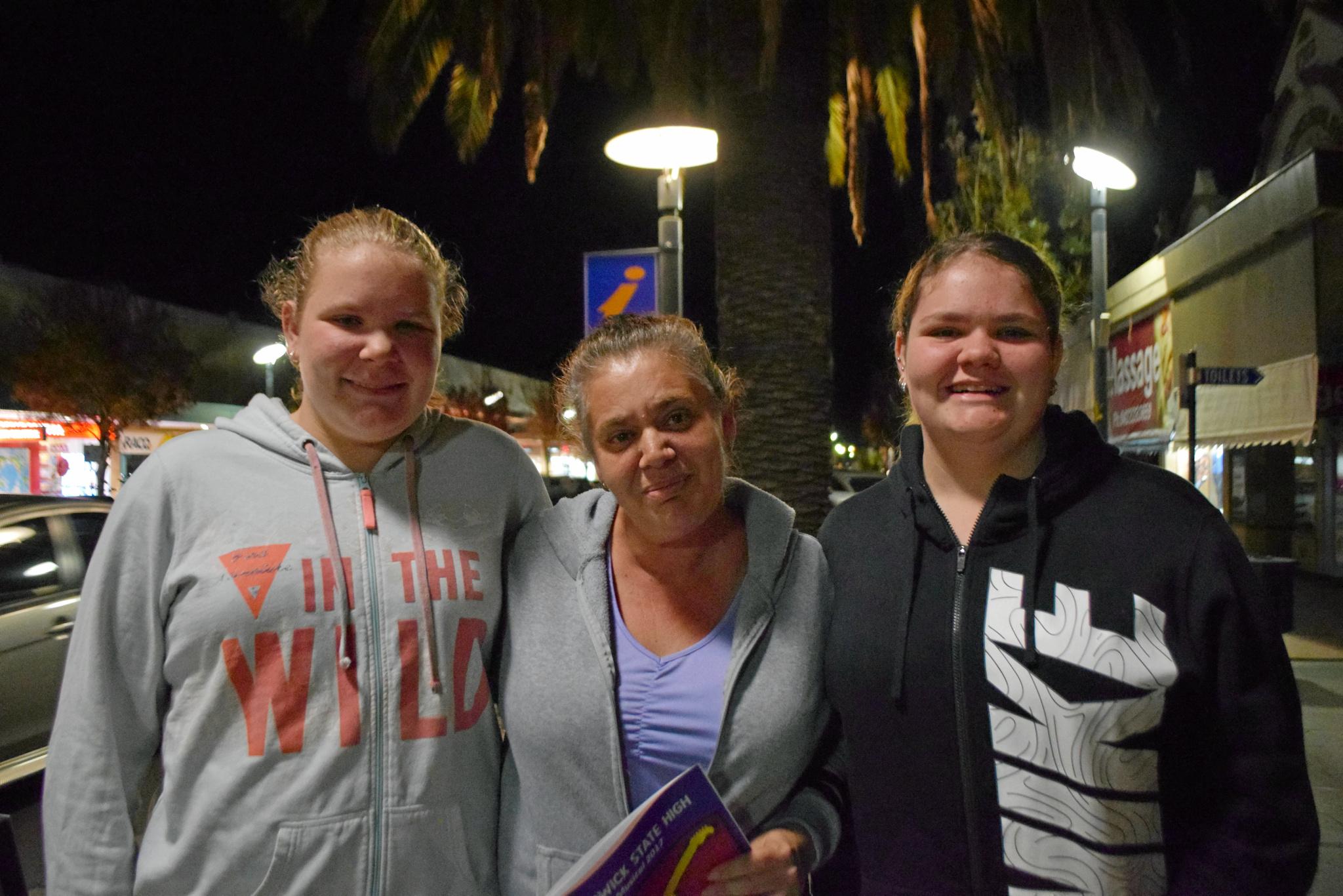 Waiting to go in are Sarah (left) and Kasey Grimshaw (right) with Joanne Cristina (centre). Picture: Jonno Colfs