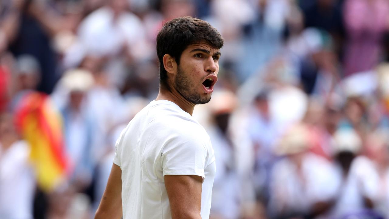 LONDON, ENGLAND - JULY 12: Carlos Alcaraz of Spain celebrates victory against Holger Rune of Denmark in the Men's Singles Quarter Final match during day ten of The Championships Wimbledon 2023 at All England Lawn Tennis and Croquet Club on July 12, 2023 in London, England. (Photo by Patrick Smith/Getty Images)