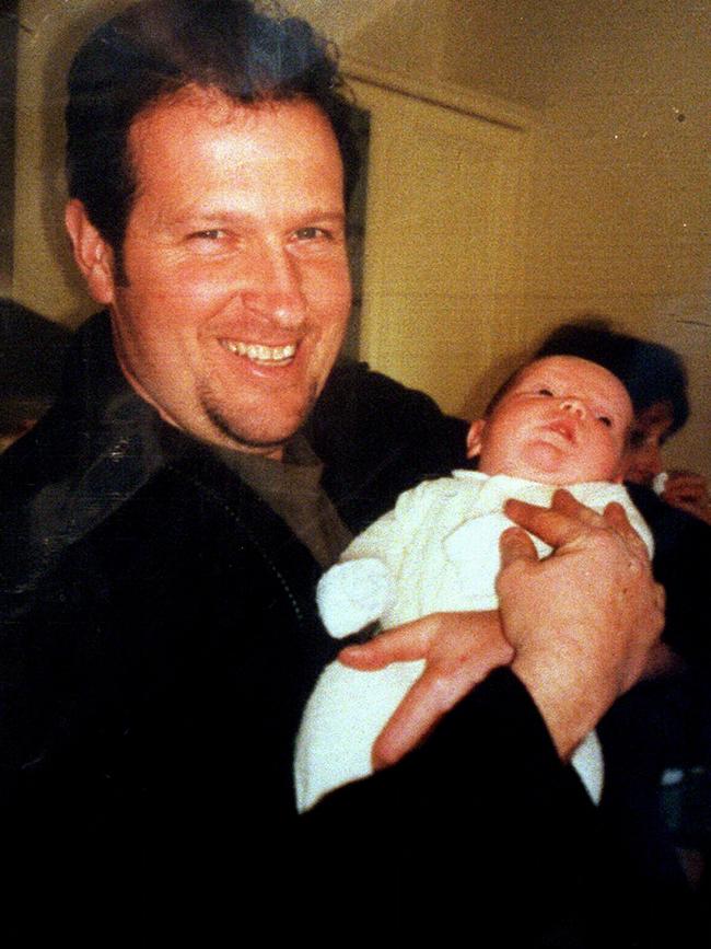 Rod Miller holding his new born son, James, shortly before he was killed.