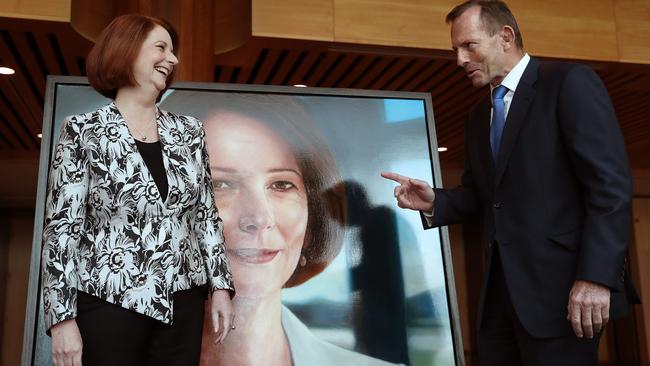 Former PM Julia Gillard and Tony Abbott at the Former PM Julia GillardÕs official portrait unveiling event at Parliament House in Canberra.Created by award-winning artist Vincent Fantauzzo, the portrait was commissioned by the Department of Parliamentary Services (DPS) for ParliamentÕs Historic Memorials Collection on Ms GillardÕs recommendation. Picture Kym Smith