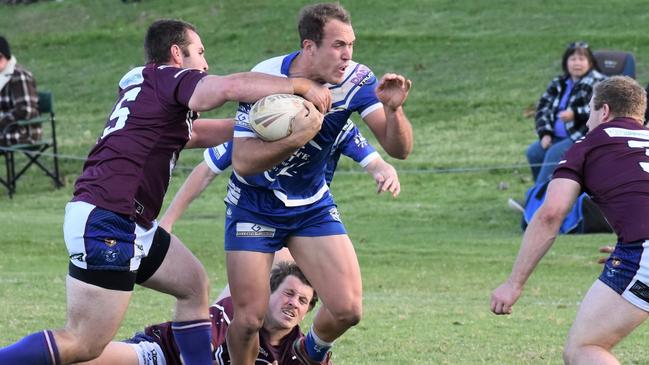 Grafton Ghosts centre Dylan Collett stopped by Macksville Sea Eagles defence.