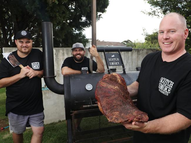 Brad Johnston, Nick Cooper and Chad Andrew from The Scotch and Smoke BBQ team pictured at Collaroy with their smoker ahead of the Meatsock Festival this weekend. Picture: David Swift.