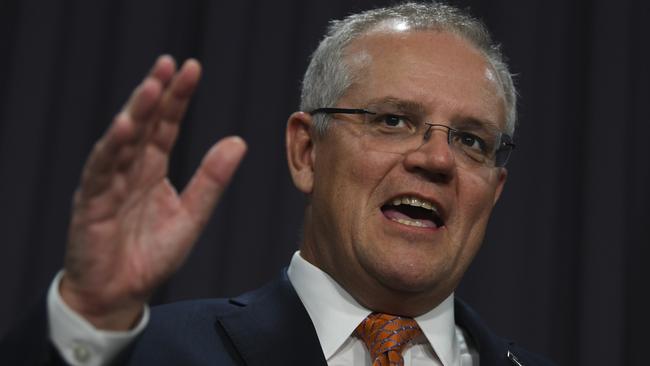 “[An electric vehicle] won’t tow your trailer. It’s not going to tow your boat. It’s not going to get you out to your favourite camping spot with your family,” Prime Minister Scott Morrison told reporters in Melbourne. Picture: AAP/Lukas Coch