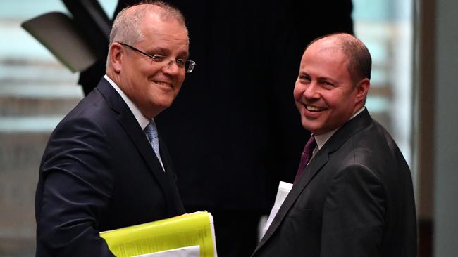 Prime Minister Scott Morrison, left, with Treasurer Josh Frydenberg, who says Australia’s economy ‘remains remarkably resilient’. Picture: AAP