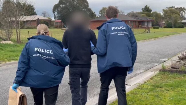 Police arrest a man in Kilmore after a string of alleged arson attacks on tobacco shops in Mebourne's northwest. Picture: Victoria Police