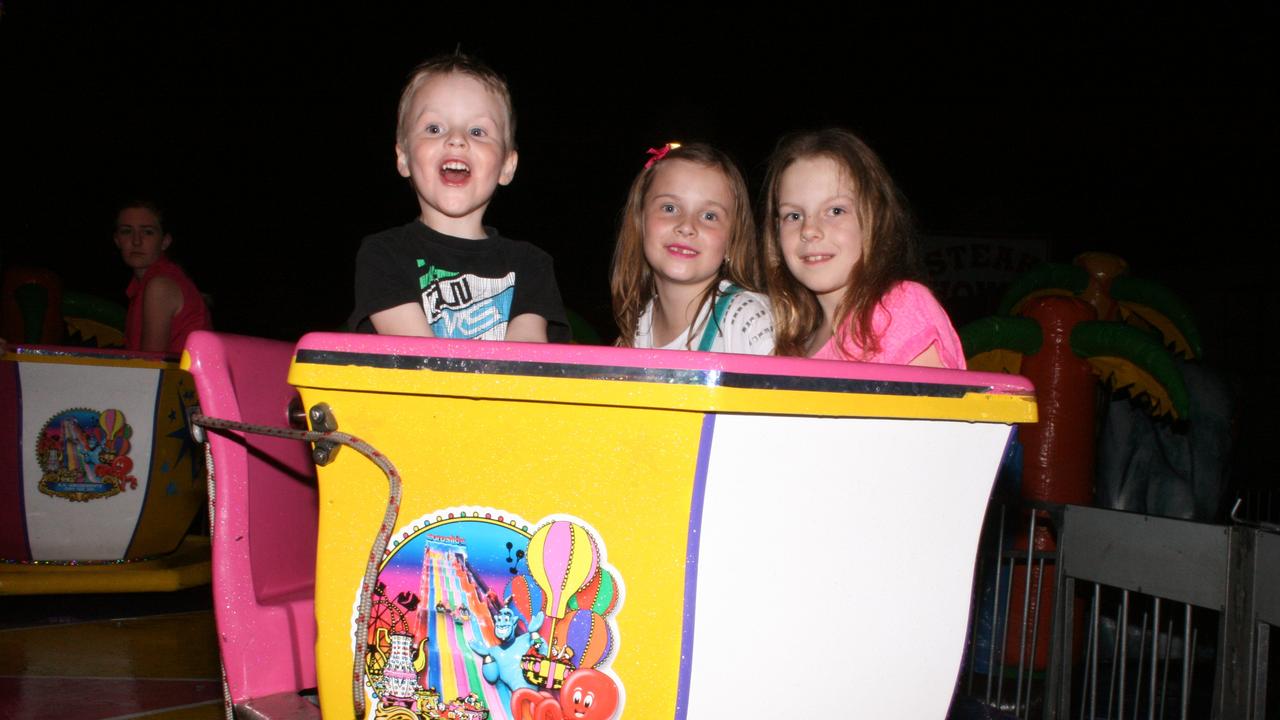 <p>Cohen and Adela Beck and Olivia Cody have fun on the spinning tea cups ride at the Warwick Rodeo Mardi Gras. Photo Deanna Millard / Daily News</p>