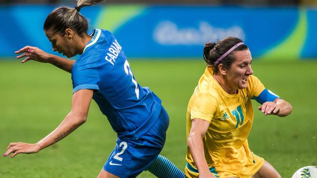 Brazil's Fabiana (L) and Australia's Lisa De Vanna fall during their Rio Olympics