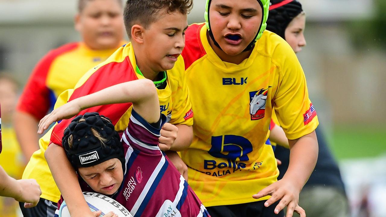 Justis Costigan making the tackle with Keahn Tuakura coming in to assist