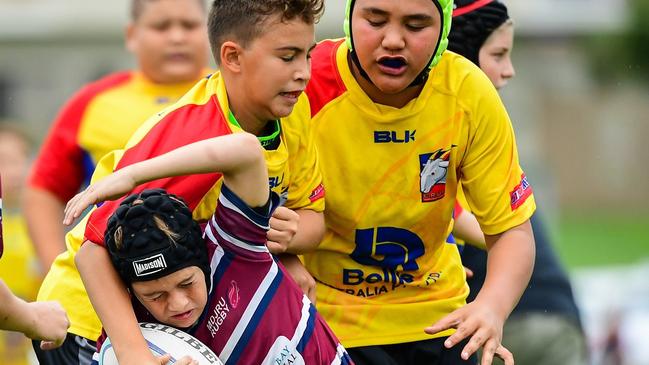 Justis Costigan making the tackle with Keahn Tuakura coming in to assist