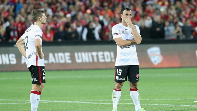 The Wanderers stand dejected after they were defeated by Adelaide United.