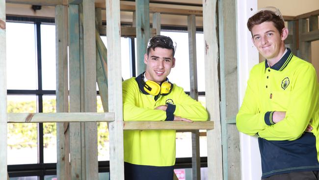 Students Jonathan Paraskevaidis and Ryan Simpson study construction pathways. Picture: Damian Shaw