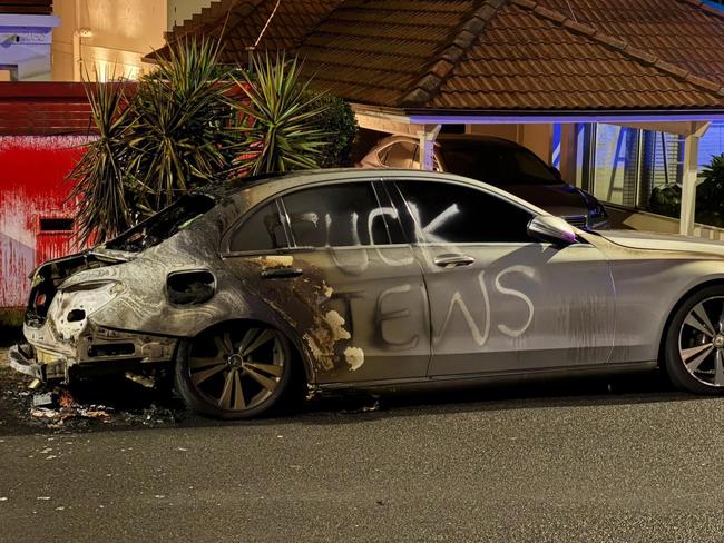 A car destroyed in an anti-Semitic firebombing in Dover Heights.