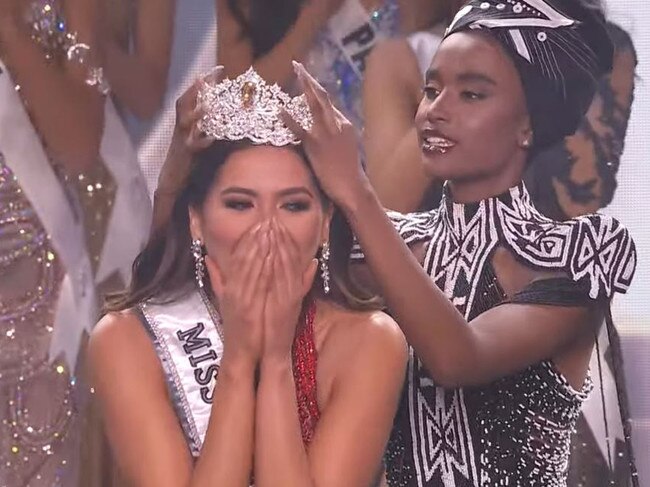 Former Miss Universe winner Zozibini Tunzi of South Africa places the crown on her head. Picture: Supplied