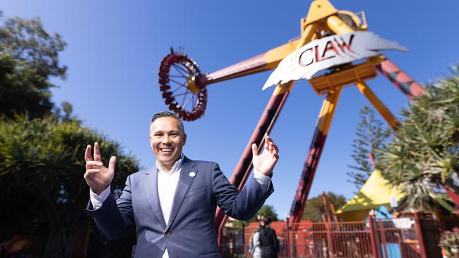 Rides such as The Claw, pictured with Dreamworld boss, Greg Yong, have a raft of comprehensive safety assessments and operation protocols since the tragedy. Picture: David Kelly