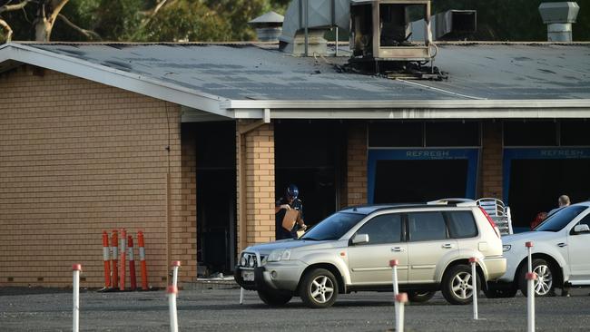 Police investigate a fire and robbery at Gepps Cross Drive-in. Picture Mark Brake