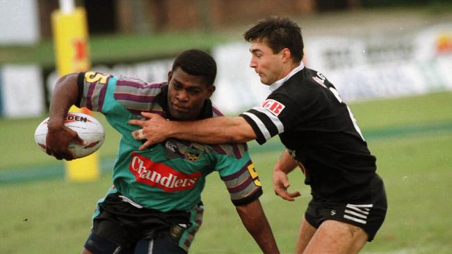 Chargers winger Marcus Bai evades the clutches of Wests' Darren Willis.