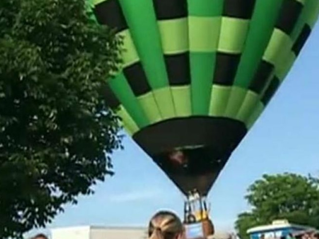 The balloon's basket knocked people to the ground. Two people suffered injuries.