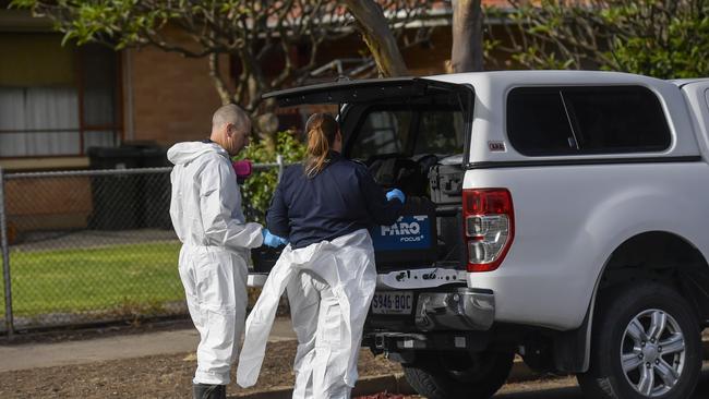 Forensic investigators at the Woodville Gardens house fire. Picture: RoyVPhotography