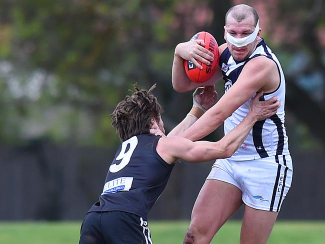 Coldstream's Lauchlan Craig is tackled by East Burwood's Jason Kennedy. Picture: Josie Hayden