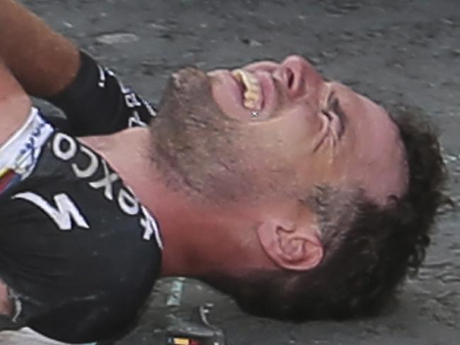 Britain's sprinter Mark Cavendish grimaces after he crashed in the last kilometers of the first stage of the Tour de France cycling race over 190.5 kilometers (118.4 miles) with start in Leeds and finish in Harrogate, England, Saturday, July 5, 2014. (AP Photo/Fred Mons, Pool)