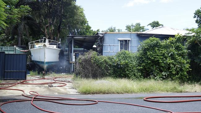 Queensland Fire and Emergency Services firefighters attend a large house fire at Barron Esplanade, Machans Beach on Thursday, February 2. Picture: Brendan Radke