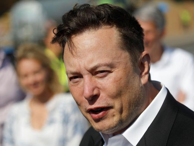 (FILES) In this file photo taken on September 3, 2020 Tesla CEO Elon Musk talks to media as he arrives to visit the construction site of the future US electric car giant Tesla, in Gruenheide near Berlin. - Musk said on October 14, 2022 his company SpaceX wouldn't be able to fund the Starlink satellite internet network over Ukraine indefinitely, amid reports he had asked the US military to cover the costs. The move comes as Musk has been embroiled in public spats with Ukranian leaders who were angered by his controversial proposals for de-escalating the conflict, which included acknowledging Russian sovereignty over Crimea. (Photo by Odd ANDERSEN / AFP)