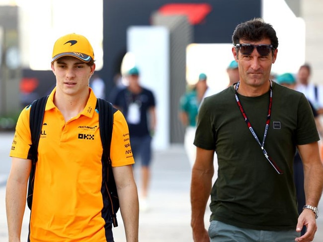 LUSAIL CITY, QATAR - OCTOBER 06: Oscar Piastri of Australia and McLaren and Mark Webber walk in the Paddock prior to practice ahead of the F1 Grand Prix of Qatar at Lusail International Circuit on October 06, 2023 in Lusail City, Qatar. (Photo by Mark Thompson/Getty Images)