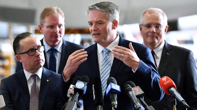 Qantas CEO Alan Joyce, left, Assistant Minister for Multicultural Affairs Craig Laundy, Acting Prime Minister Senator Mathias Cormann and Federal Treasurer Scott Morrison. Picture: AAP.