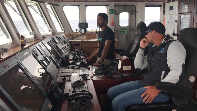 Rainbow Warrior III crew member Amrit Bakshi and whale watching charter guide Paul Cross. Picture: Ben Brennan