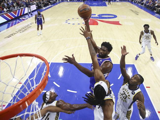 PHILADELPHIA, PENNSYLVANIA - OCTOBER 24: Joel Embiid #21 of the Philadelphia 76ers shoots over Isaiah Jackson #22 of the Indiana Pacers during the first quarter at Wells Fargo Center on October 24, 2022 in Philadelphia, Pennsylvania. NOTE TO USER: User expressly acknowledges and agrees that, by downloading and or using this photograph, User is consenting to the terms and conditions of the Getty Images License Agreement.   Tim Nwachukwu/Getty Images/AFP