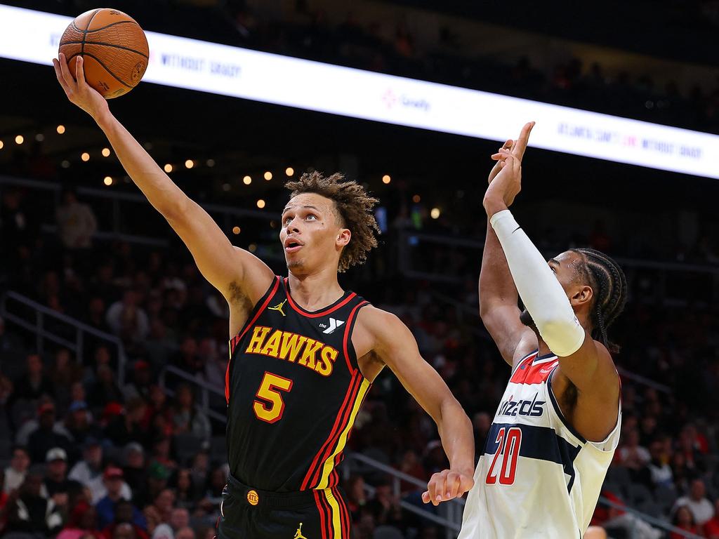 Dyson Daniels, left, drives against Alexandre Sarr, #20 of the Washington Wizards, in front of a home crowd on November 15 in Atlanta, Georgia. Picture: Kevin C. Cox/Getty Images/AFP