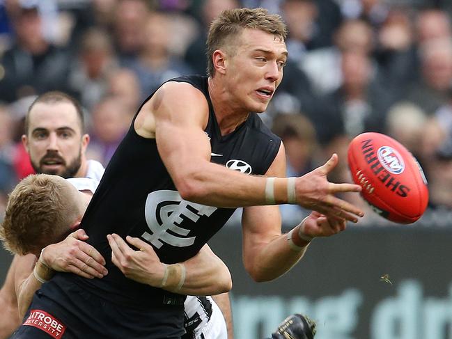 AFL Round 8. Carlton v Collingwood at the MCG. 10/05/2019.  Patrick Cripps of the Blues clears by hand 3rd quarter    .  Pic: Michael Klein.