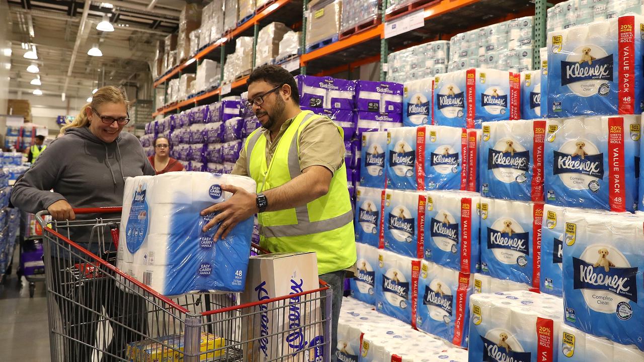 Staff members assist shoppers at Costco Perth on March 19, 2020 in Perth, Australia. Picture: Paul Kane/Getty Images