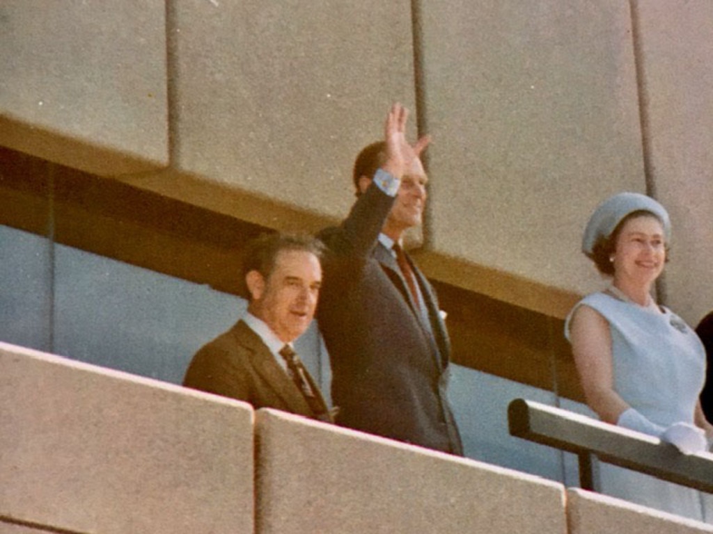 Prince Philip waves as he and the Queen attend the official opening of the Opera House.