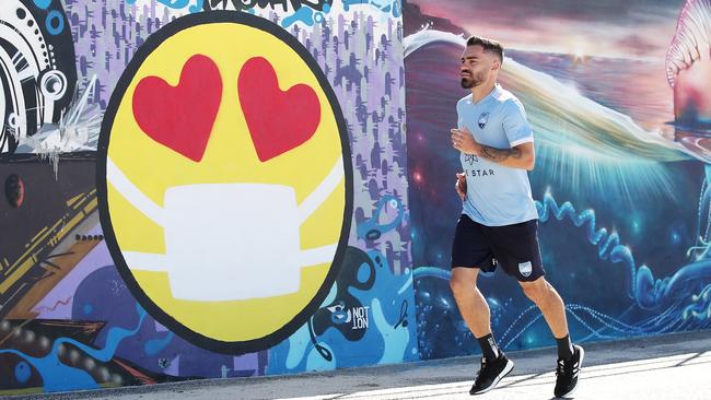 Sydney FC player Anthony Caceres trains by himself at Bondi Beach. The players' union is pushing for A-League players to be able to recommence group training early next month. Picture: Getty Images