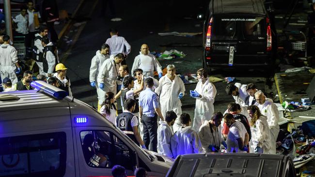 Forensic police work the explosion site at Ataturk airport. Picture: AFP/OZAN KOSE