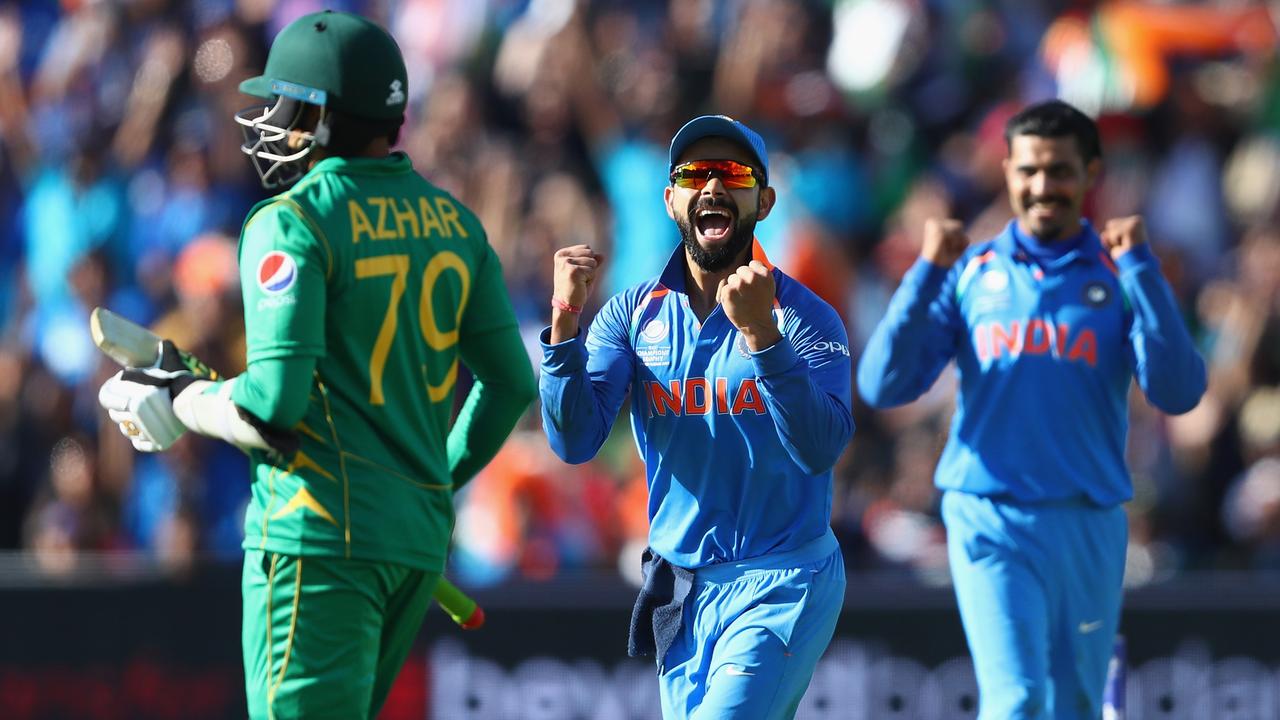 BIRMINGHAM, ENGLAND - JUNE 04: Virat Kohli (C) of India celebrates as Ravindra Jadeja captures the wicket of Azhar Ali of Pakistan during the ICC Champions Trophy match between India and Pakistan at Edgbaston on June 4, 2017 in Birmingham, England. (Photo by Michael Steele/Getty Images)