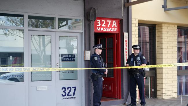 Police guard the entrance to Marilyn’s Studio — the scene of the 13-hour siege. Picture: Sarah Reed