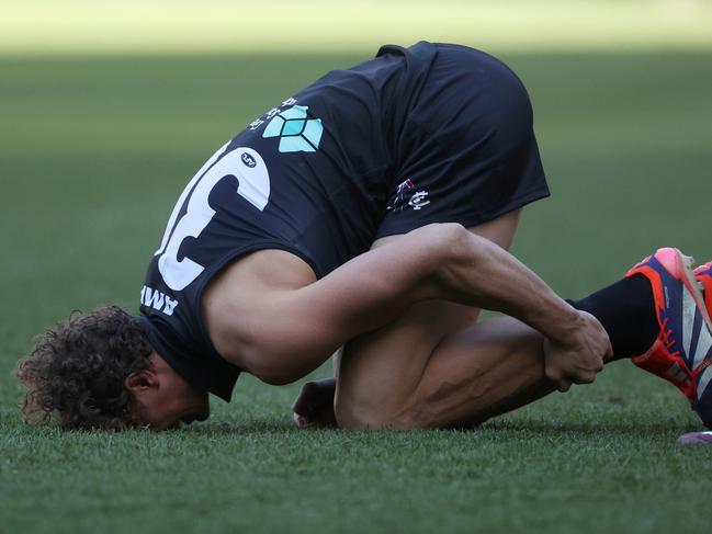 MELBOURNE, AUSTRALIA – AUGUST 11: Charlie Curnow of the Blues reacts after sustaining an injury during the round 22 AFL match between Carlton Blues and Hawthorn Hawks at Melbourne Cricket Ground, on August 11, 2024, in Melbourne, Australia. (Photo by Daniel Pockett/Getty Images)