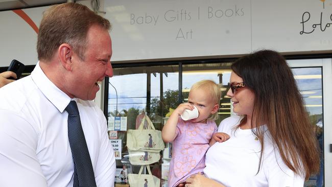 Steven Miles meets a somewhat cranky little Lotte Pickett and Madeline Burwin on Oxford Street, Bulimba, on Tuesday. Picture: Adam Head