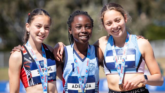 NSW All Schools Athletics podium with. Rhema Adelaja centre.